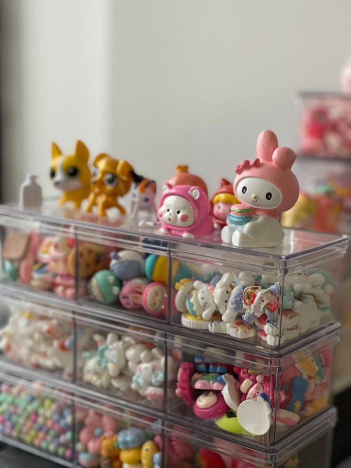 Vibrant collection of cute toy figurines displayed on transparent shelves, perfect for decoration or play.